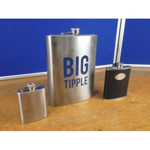 390 - A 'Big Tipple' stainless steel hip flask and two others.