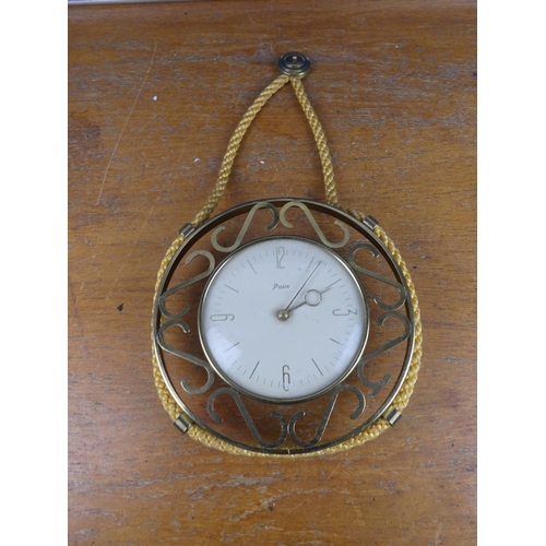 554 - A vintage Paico wall clock with rope detail.