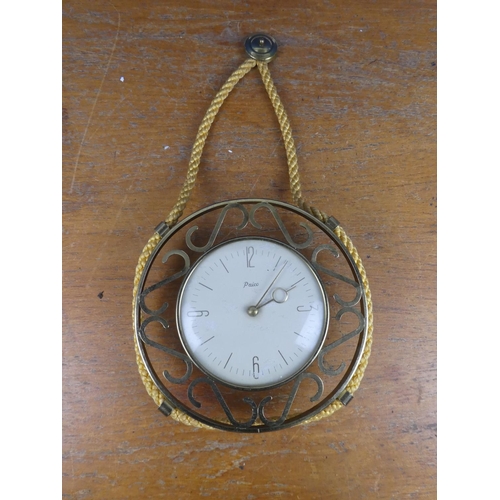 554 - A vintage Paico wall clock with rope detail.