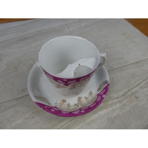 19 - A large vintage moustache cup and saucer.