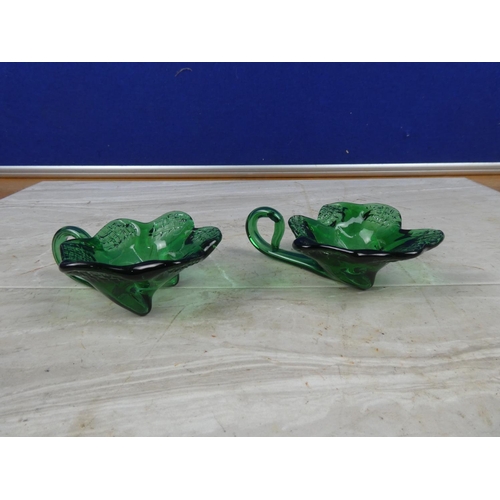 34 - A pair of vintage green glass tea light holders.