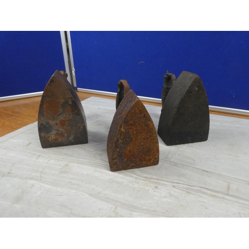 5 - Three antique irons.