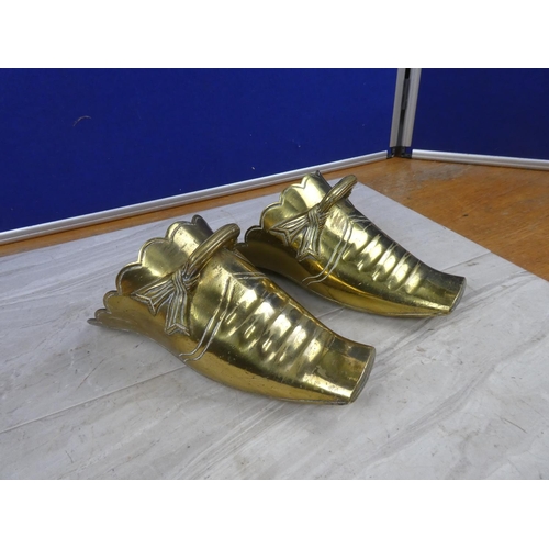 62 - A large pair of antique brass stirrups.