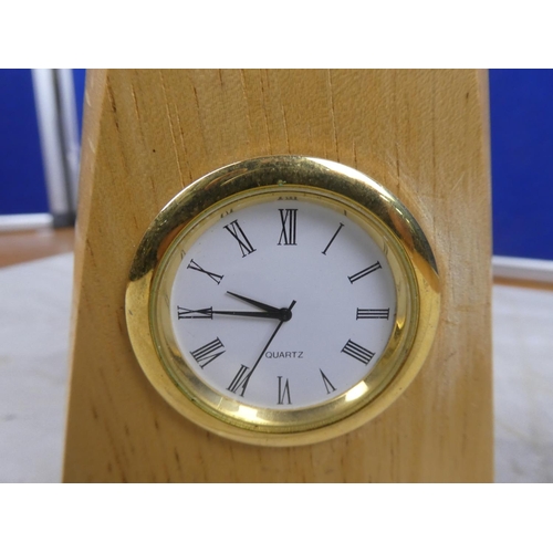 65 - A wooden cased  quartz mantle clock.