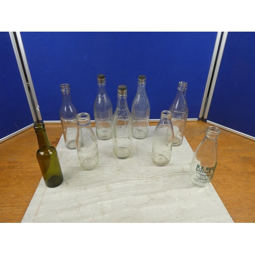 7 - A collection of antique and vintage milk bottles and more to include H S Hezlett Liffock Dairy, Broc... 
