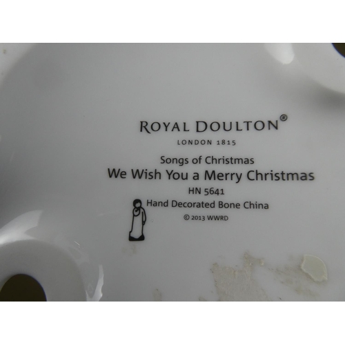 74 - A Royal Doulton Songs of Christmas figure, 'We Wish You a Merry Christmas'.