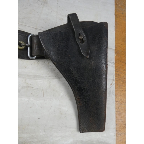 77 - An antique Royal Ulster Constabulary/ Royal Irish Constabulary belt & pistol holster.