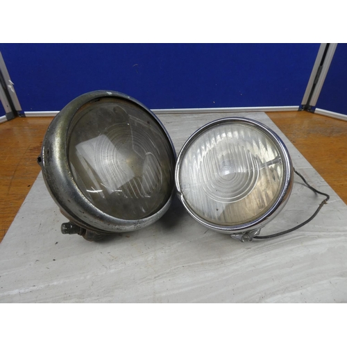 583 - Two vintage tractor lights.