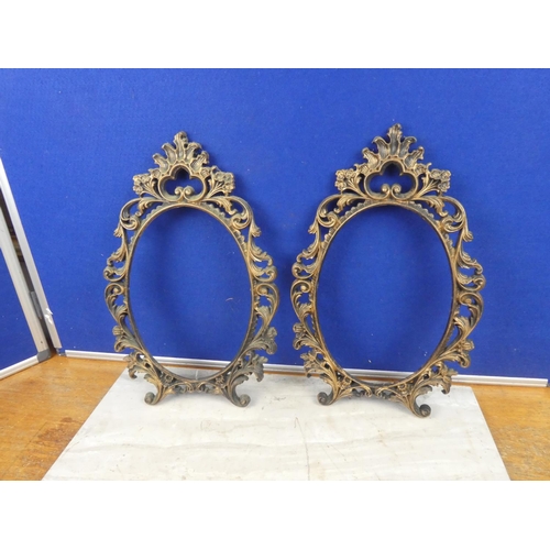 586 - Two plastic picture frames. Approx 40x27cm each.