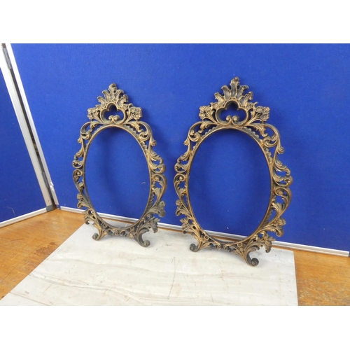 586 - Two plastic picture frames. Approx 40x27cm each.