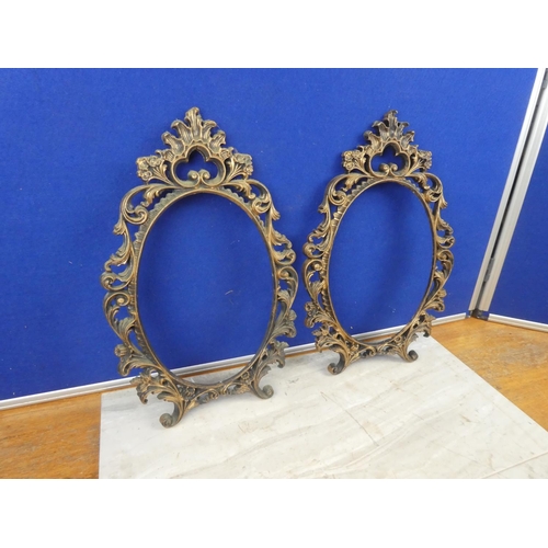 586 - Two plastic picture frames. Approx 40x27cm each.