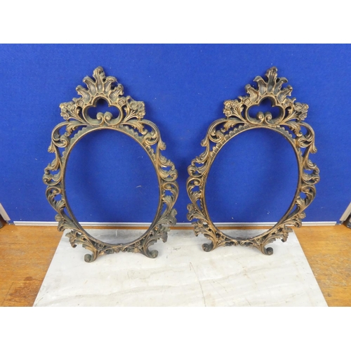 586 - Two plastic picture frames. Approx 40x27cm each.