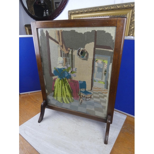 591 - A vintage oak framed firescreen with a tapestry panel. approx 68x53cm.