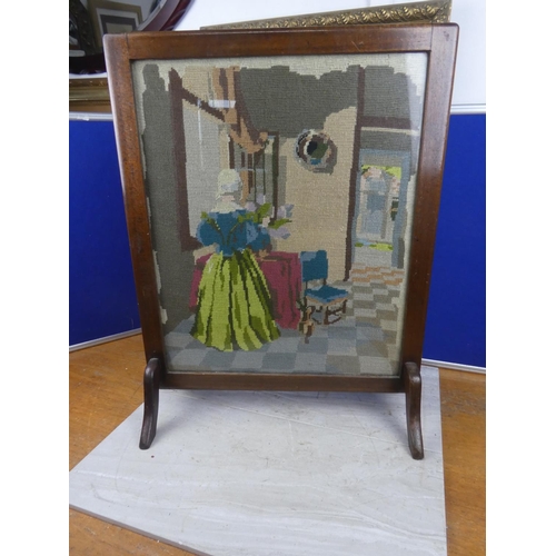 591 - A vintage oak framed firescreen with a tapestry panel. approx 68x53cm.