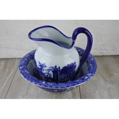 607 - A blue and white ware pottery jug and basin set.