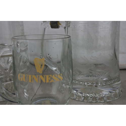 625 - An assortment of vintage pub tankards to include Guinness & more.