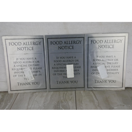 627 - Three metal food allergy notice signs.