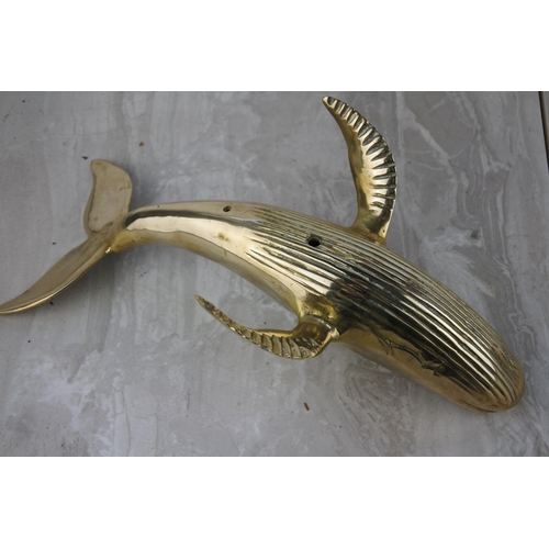 630 - A large brass whale.