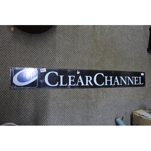 641 - A vintage 'Clear Channel' metal advertising sign. Approx 124x15cm.