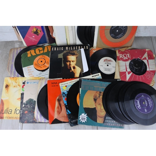 670 - A lot of vintage 45's records to include Luther Vandross, Jack Payne, Nick Kamen and more.