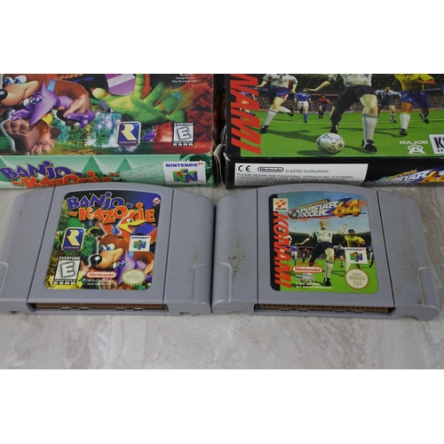 696 - Two boxed Nintendo 64 cartridges 'Banjo - Kazooie' and 'Konami - International Superstar Soccer' and... 