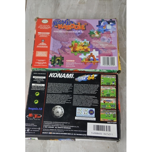 696 - Two boxed Nintendo 64 cartridges 'Banjo - Kazooie' and 'Konami - International Superstar Soccer' and... 