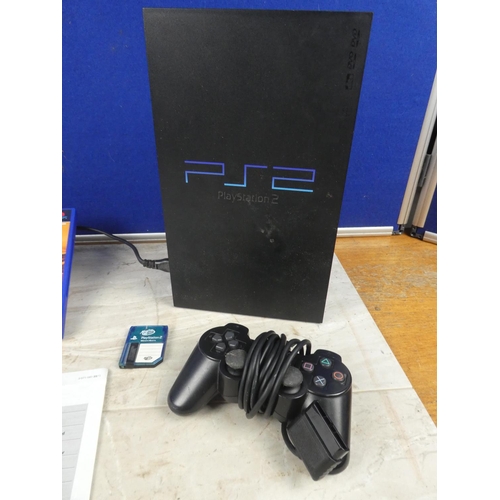 702 - A Playstation 2 console, controller, instruction manual and Pro Evolution Soccer 3 game.