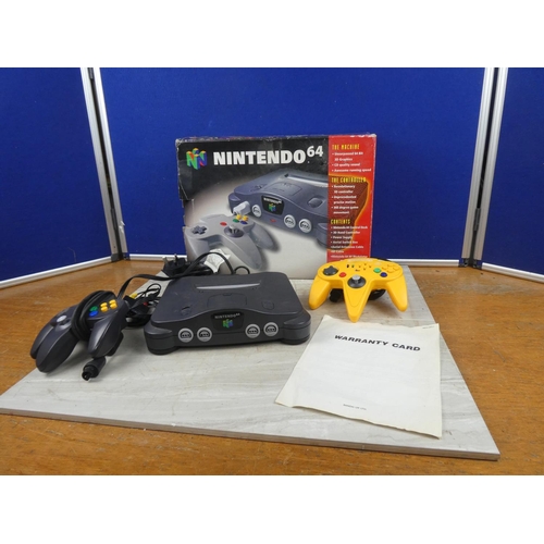 703 - A boxed Nintendo 64 console and controller.