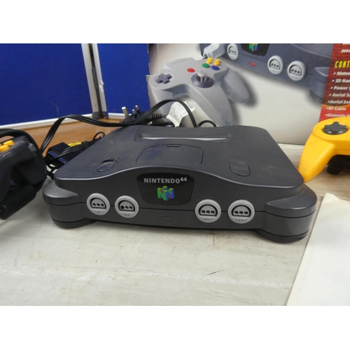 703 - A boxed Nintendo 64 console and controller.