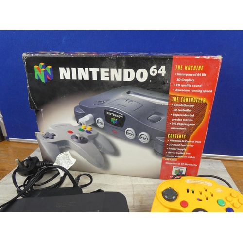 703 - A boxed Nintendo 64 console and controller.