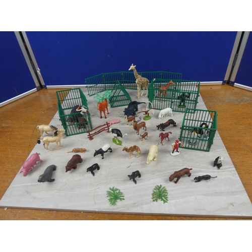 707 - An assortment of metal farm gates, plastic toy animals.