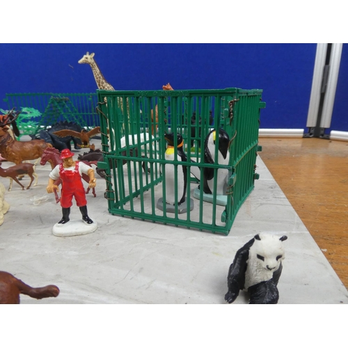 707 - An assortment of metal farm gates, plastic toy animals.