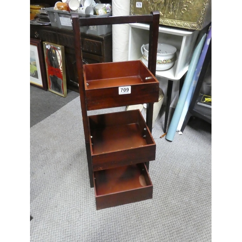 709 - A wooden three tray storage unit. Approx 91x31x29cm.