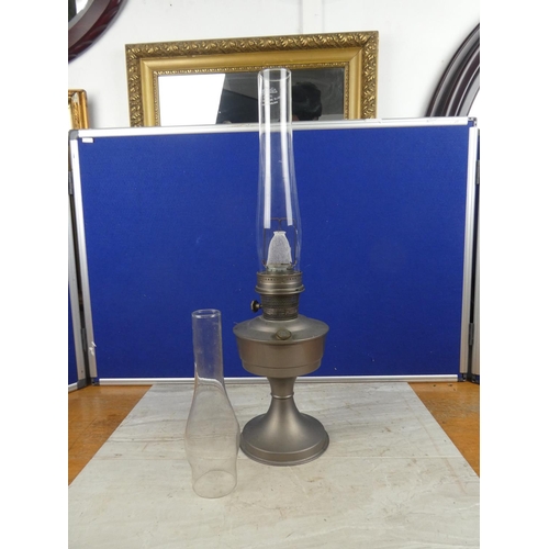 713 - A vintage Aladdin No21 oil lamp and a spare oil lamp funnel. Approx 60cm.