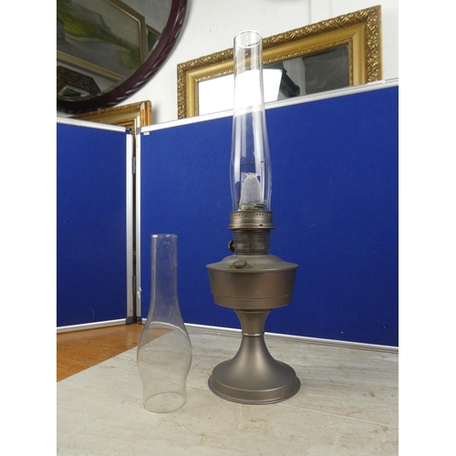 713 - A vintage Aladdin No21 oil lamp and a spare oil lamp funnel. Approx 60cm.