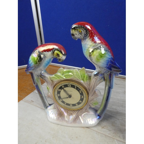 715 - A vintage Polaris ornamental mantle clock decorated with birds and another of a thermometer.