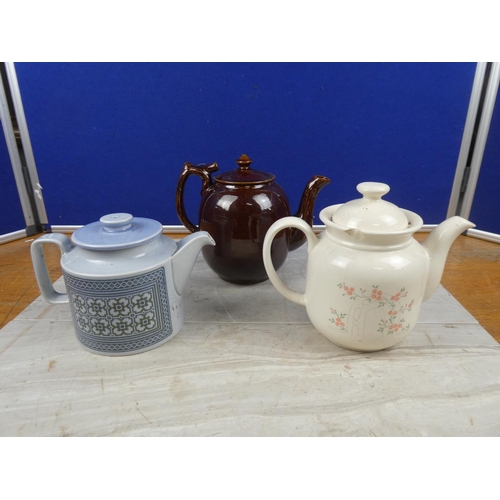 129 - A vintage Hornsea pottery teapot and two others.