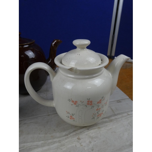 129 - A vintage Hornsea pottery teapot and two others.