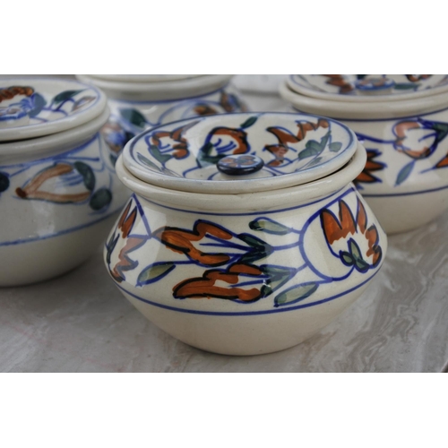 214 - Four lidded pottery spice pots.