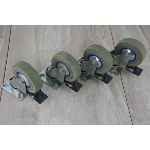 10 - Four industrial caster wheels.