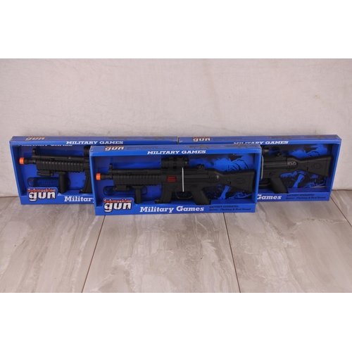13 - Three boxed toy guns.