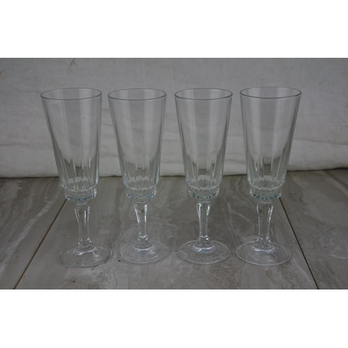 20 - A set of four champagne glasses.