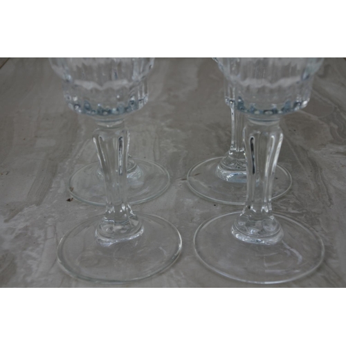 20 - A set of four champagne glasses.