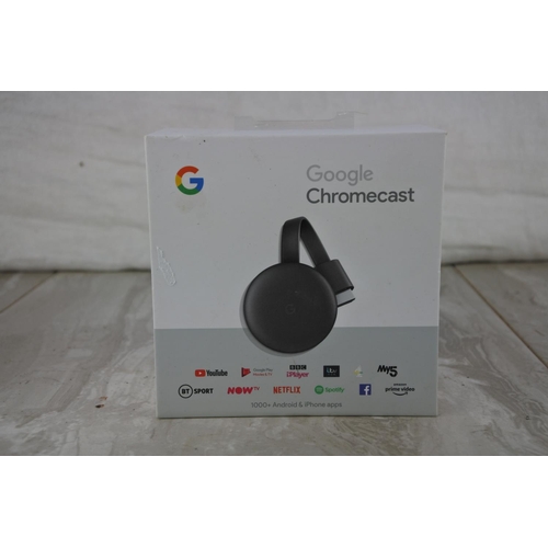 22 - A boxed Google Chromecast.