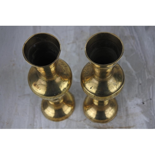 67 - A pair of vintage brass flower vases. Approx 20cm.