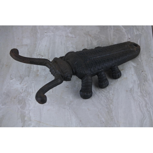 68 - A cast iron 'Beetle' boot pull/ jack.