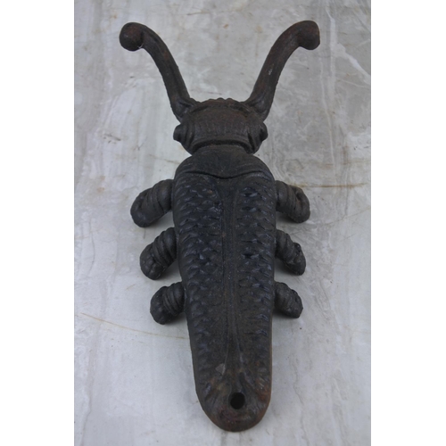 68 - A cast iron 'Beetle' boot pull/ jack.