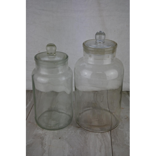 71 - Two large glass containers. Tallest approx 33cm.