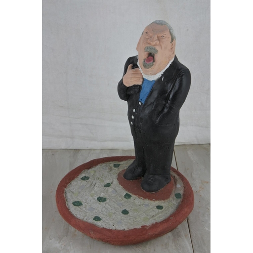 77 - A concrete garden figure of the Rev. Ian Paisley. Approx 34cm.