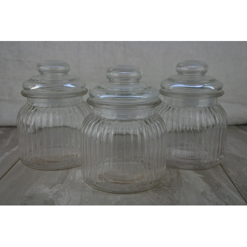 8 - Thee lidded glass jars.